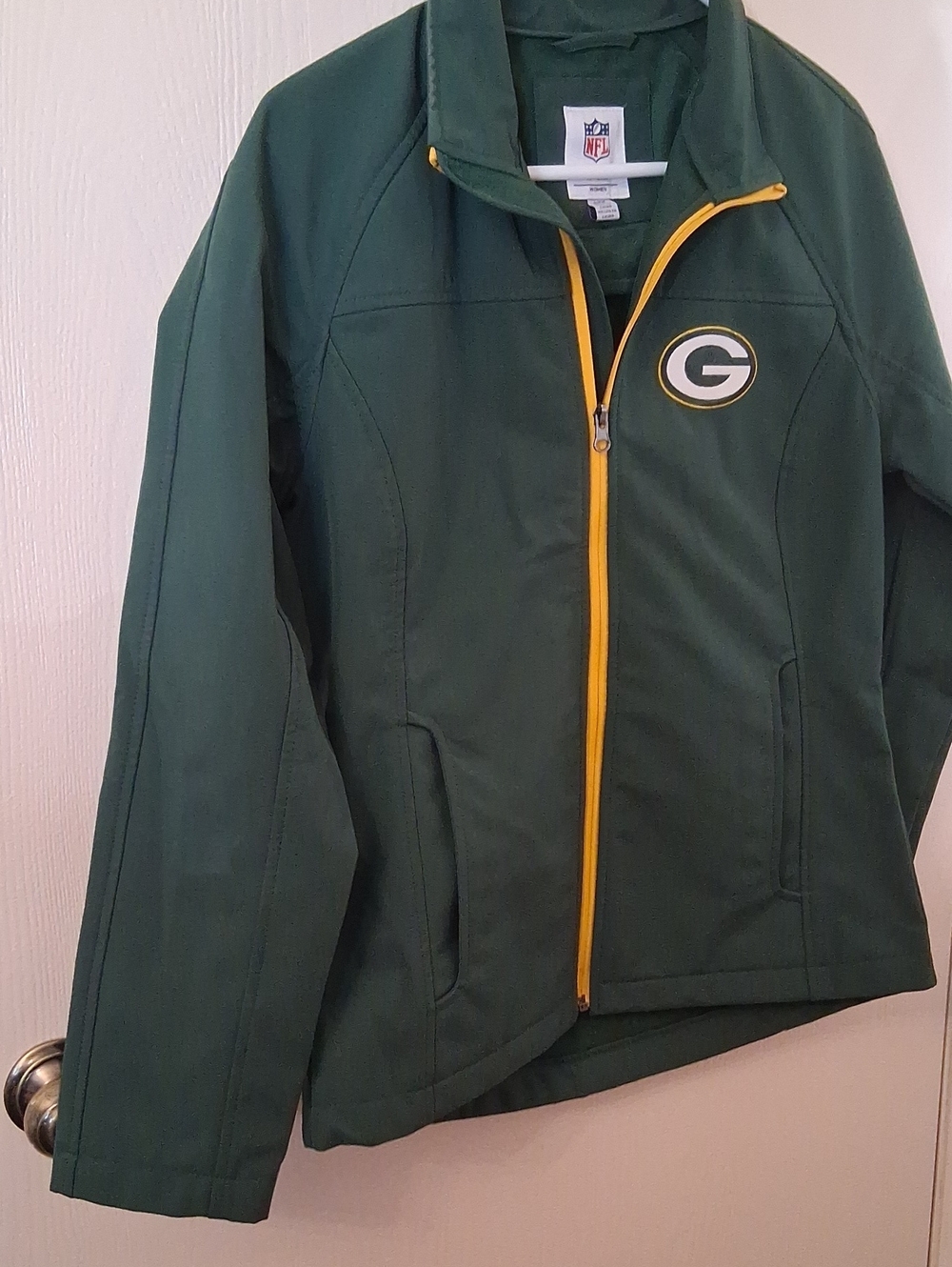 NFL Packers Green Women's Zip-Up Jacket with Gold Trim.